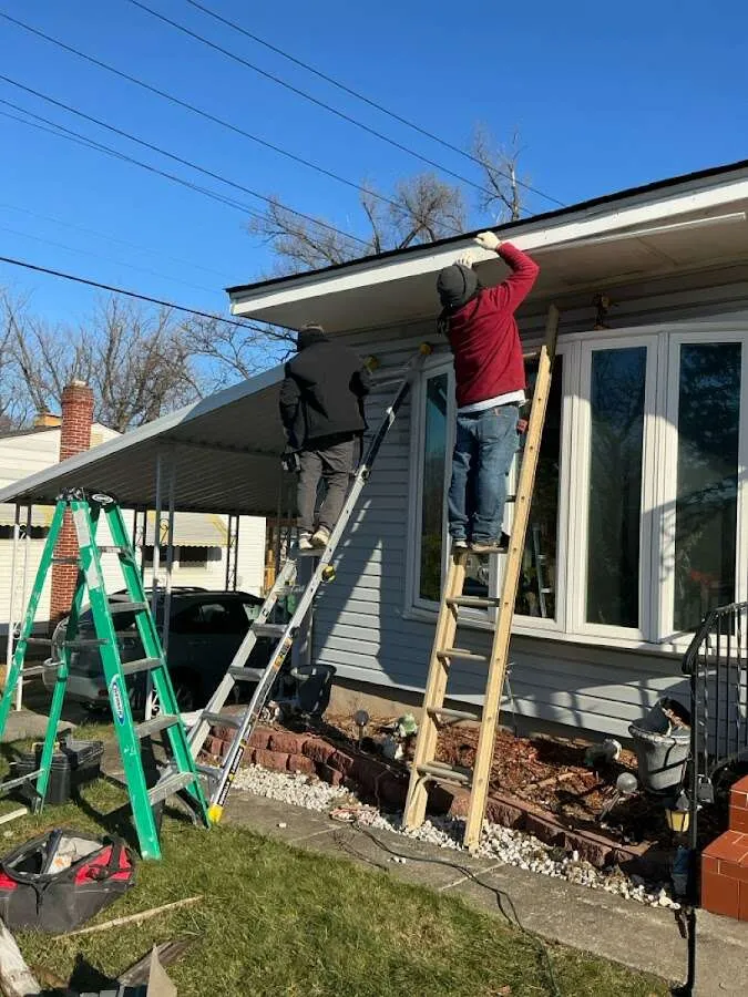 Restoration crew performing exterior repair in Tuskegee